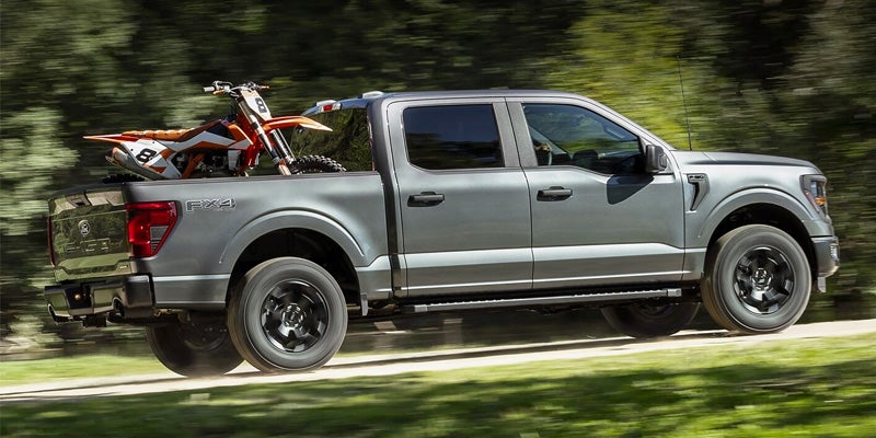 Silver Ford F-150 carrying a bike