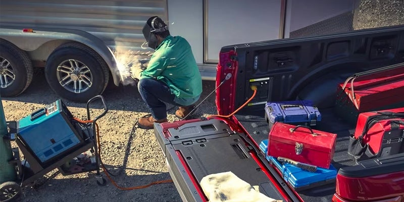 Man connecting power equipment at work site